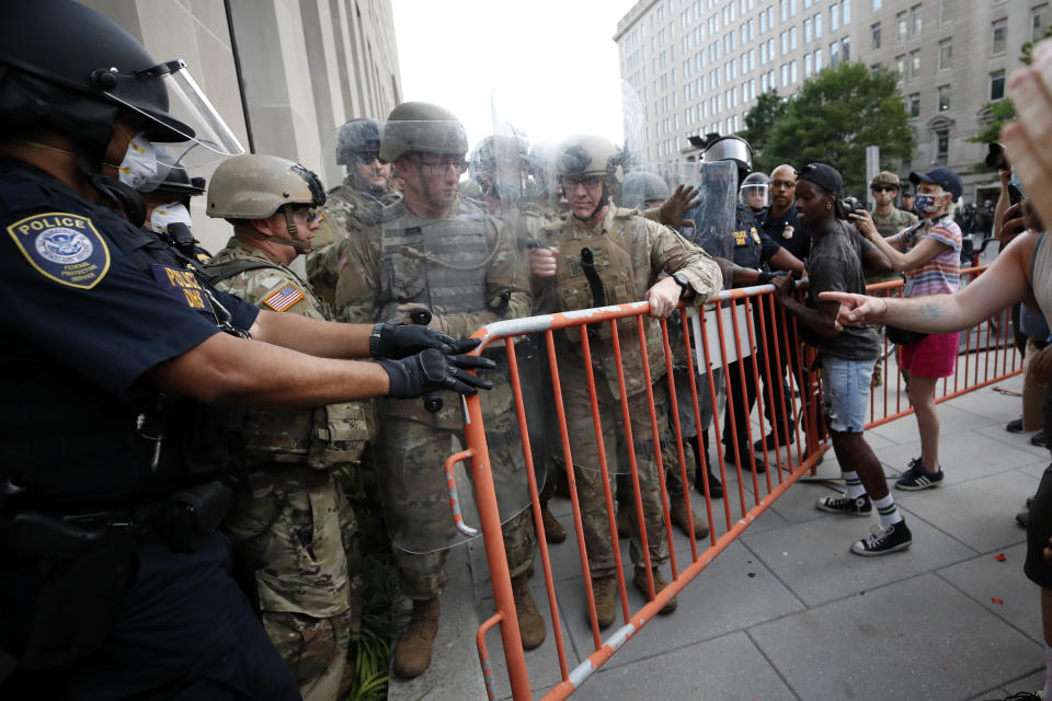 National Guard soldiers and Department of Homeland Security Police secure a fence barricade as demonstrators gather to protest the death of George Floyd, Wednesday, June 3, 2020, near the White House in Washington. Floyd died after being restrained by Minneapolis police officers. (AP Photo/Alex Brandon)