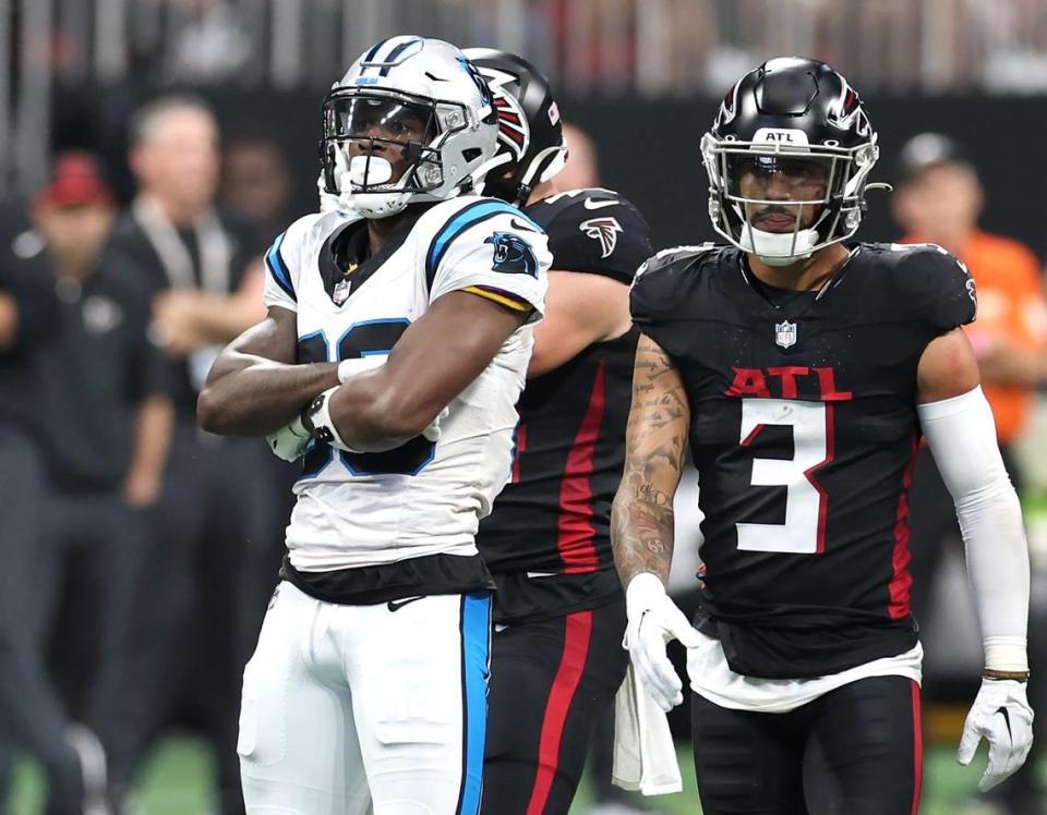Carolina Panthers wide receiver Terrace Marshall celebrates his pass reception during first half action as Atlanta Falcons safety Jessie Bates III, right, passes at Mercedes-Benz Stadium in Atlanta, GA on Sunday, September 10, 2023. The Falcons defeated the Panthers 24-10.