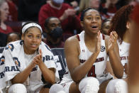 South Carolina guard Zia Cooke, left, and forward Aliyah Boston applaud their team during the second half of an NCAA college basketball game against Arkansas in Columbia, S.C., Sunday, Jan. 22, 2023. (AP Photo/Nell Redmond)