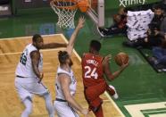 Nov 12, 2017; Boston, MA, USA; Toronto Raptors forward Norman Powell (24) looks to pass the ball past Boston Celtics center Aron Baynes (46) and forward Al Horford (42) during the first half at TD Garden. Bob DeChiara-USA TODAY Sports