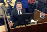 FILE - In this March 26, 2018 photo, U.S. Rep. David Cicilline completes his census form on a computer at a library in Providence, R.I., during the nation's only test run of the 2020 Census. The U.S. Census Bureau is using new high-tech tools to help get an accurate population count next year as its facing criticism for the way it plans to reach out to people of color. (AP Photo/Michelle R. Smith,File)
