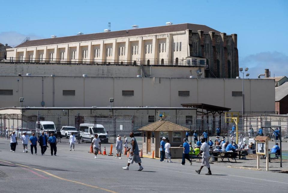 Inmates exercise outside in the yard at San Quentin State Prison in San Rafael on July 26, 2023. California lawmakers delayed votes on several monumental criminal justice reform bills this year. Advocates say it’ll take years to make them law.