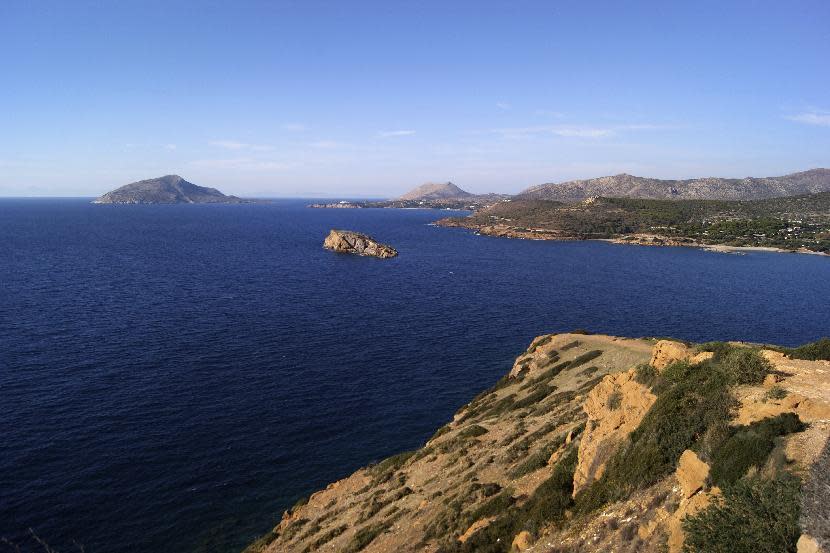 This Dec. 12, 2016 photo, shows the view from the Temple of Poseidon, an ancient hilltop structure the southern peninsula of Sounion dedicated to the god of the sea. For travelers with more than beaches on their minds, there's plenty of upside to a brief winter visit to Athens that avoids the crowds and heat of summer. (Jerrin Heller via AP)