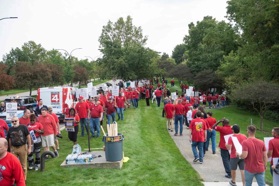 Members of the United Auto Workers (UAW) union hold a practice picket in front of Stellantis headquarters in Auburn Hills, Michigan, on September 20, 2023.