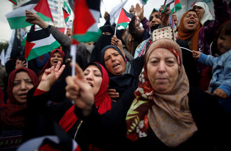 Palestinian women shout slogans during a protest against the U.S. intention to move its embassy to Jerusalem and to recognize the city of Jerusalem as the capital of Israel, in Gaza City December 6, 2017. REUTERS/Mohammed Salem