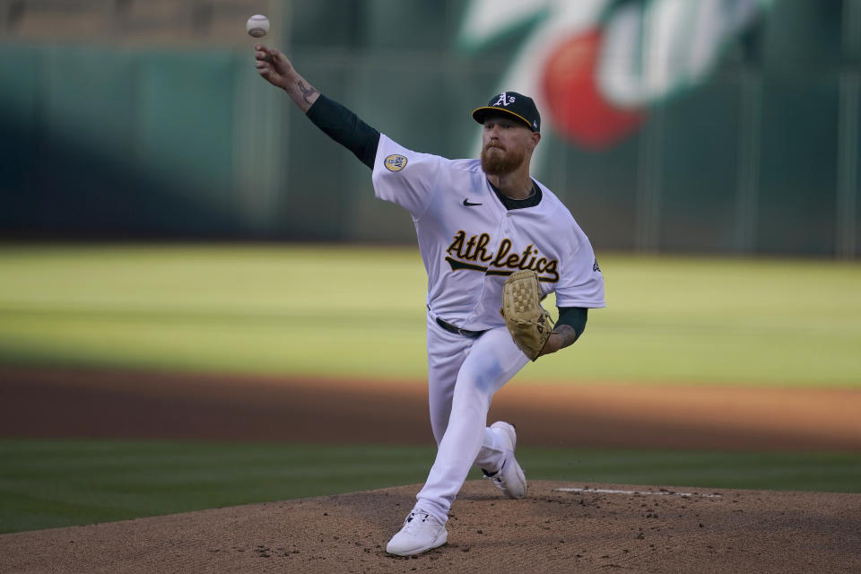 Oakland Athletics' Adam Oller pitches against the Houston Astros during the first inning of a baseball game in Oakland, Calif., Monday, July 25, 2022. (AP Photo/Jeff Chiu)