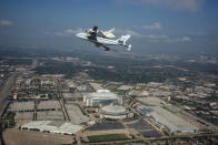 Space Shuttle Endeavour is ferried by NASA's Shuttle Carrier Aircraft (SCA) over Houston, Texas on September 19, 2012. NASA pilots Jeff Moultrie and Bill Rieke are at the controls of the Shuttle Carrier Aircraft. Photo taken by NASA photographe
