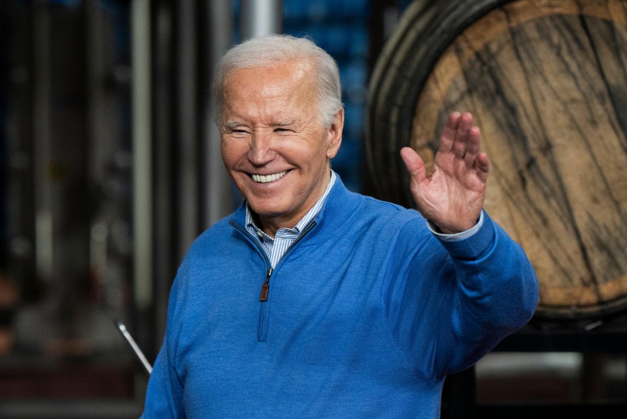 President Joe Biden waves to the audience after speaking about funding for the I-535 Blatnik Bridge at Earth Rider Brewery on January 25, 2024 in Superior, Wisconsin.