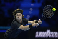 Russia's Andrey Rublev returns the ball to Germany's Alexander Zverev during their singles tennis match of the ATP World Tour Finals at the Pala Alpitour, in Turin, Italy, Friday, Nov. 17, 2023. (AP Photo/Antonio Calanni)