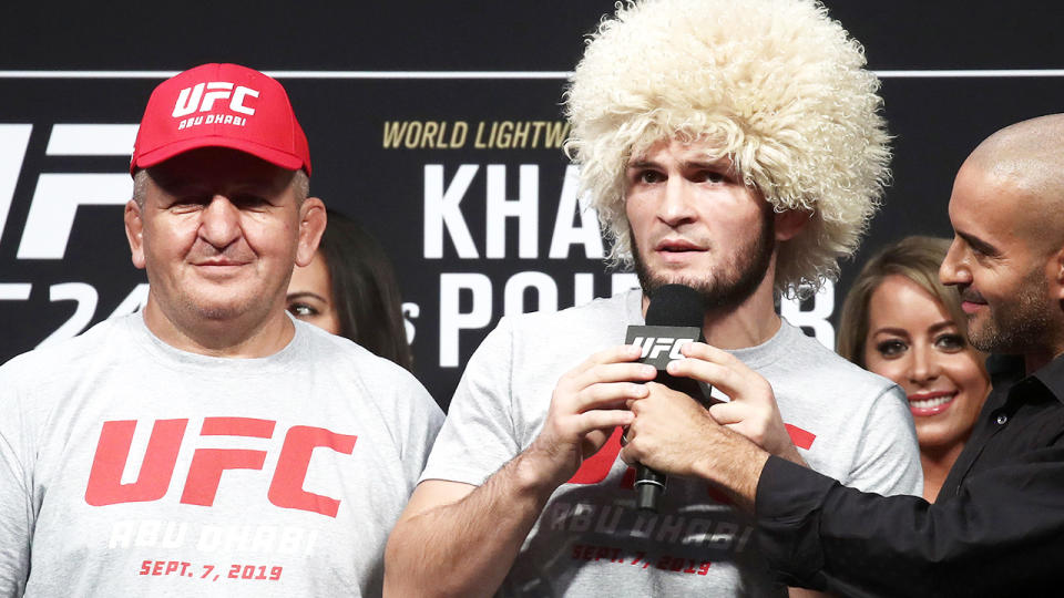 Khabib Nurmagomedov, pictured here with father and coach Abdulmanap at UFC 242.