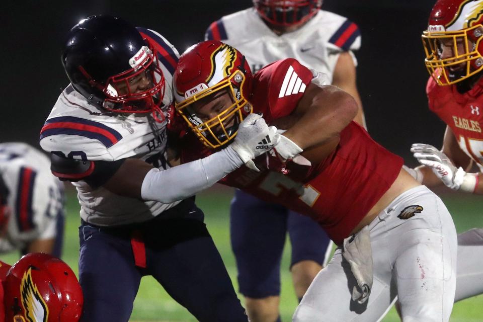 Hartley's Charlie McCall brings down Big Walnut's Nate Severs during a game Aug. 19 at Big Walnut High School in Sunbury.