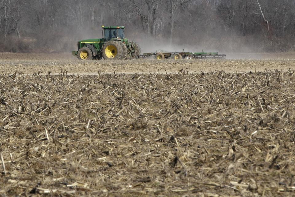 FILE - This Jan. 30, 2014 file photo shows a farmer taking advantage of dry weather to till a field in preparation for spring planting near England, Ark. Congress has given its final approval to a sweeping five-year farm bill that provides food for the needy and subsidies for farmers. Ending years of political battles, the Senate vote Tuesday sends the measure to President Barack Obama, who is expected to sign it. (AP Photo/Danny Johnston, File)