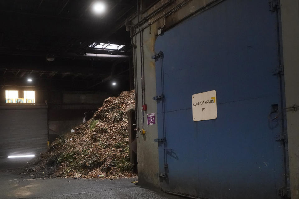 Oganic material is piled up behind a digester at a GreenWaste Zanker Resource Recovery Facility in San Jose, Calif., Friday, Oct. 27, 2023. A pair of recent reports from the EPA put striking numbers to the problem of food waste: one-third of the food produced in the U.S. is never eaten. California began requiring every jurisdiction to provide organic waste collection services starting in 2022. (AP Photo/Jeff Chiu)