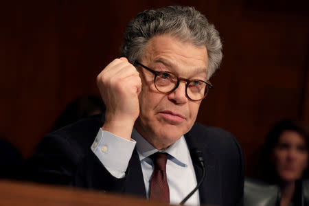 FILE PHOTO: Senator Al Franken (D-MN) questions Alex Azar (not pictured) during a Senate Health, Education, Labor and Pensions Committee hearing on his nomination to be Health and Human Services secretary on Capitol Hill in Washington, U.S., November 29, 2017. REUTERS/Yuri Gripas/File Photo