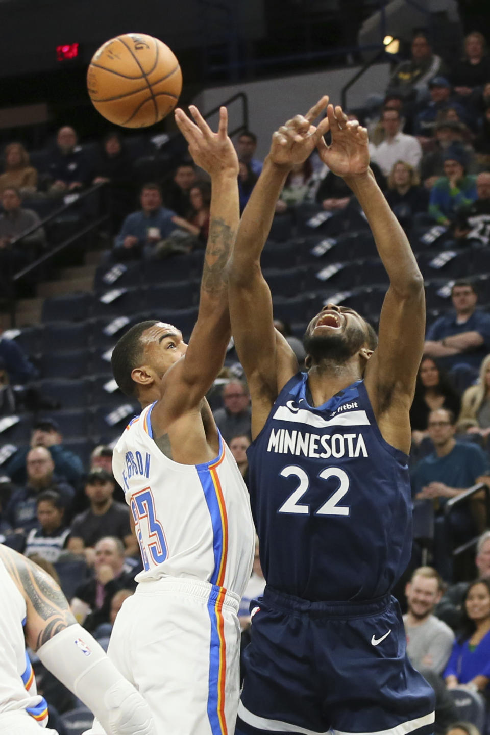 Oklahoma City Thunder's Terrance Ferguson, left, knocks the ball away from Minnesota Timberwolves' Andrew Wiggins in the first half of an NBA basketball game Monday, Jan. 13, 2020, in Minneapolis. (AP Photo/Jim Mone)