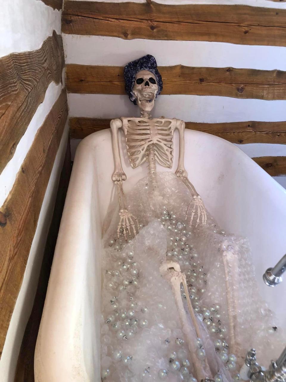 A skeleton relaxes in the Spooky Cabin at the 2022 Rassawek Autumn Festival.