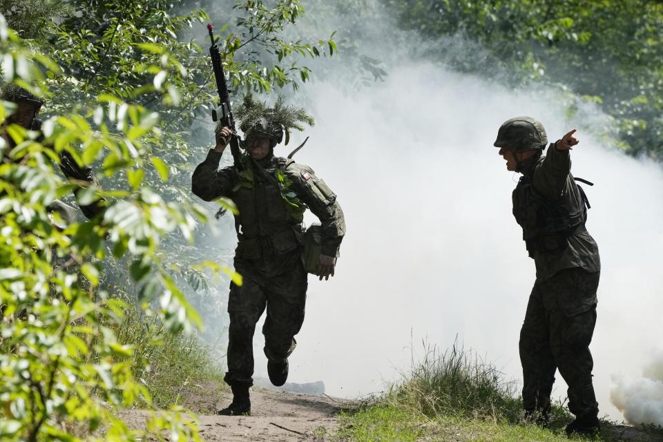 Volunteers in Poland's army practice tactics during basic training in Nowogrod, Poland, on Thursday June 20, 2024. Poland’s army has launched a program this summer called “Holidays with the Army” to train young volunteers in combat. Nations along NATO’s eastern flank are strengthening their defenses while fearing that Russia could one day attack them if it prevails in neighboring Ukraine. (AP Photo/Czarek Sokolowski)