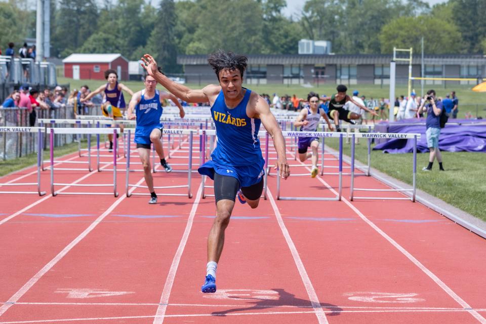 Washingtonville senior Elijah Mallard easily wins the 110-meter hurdles semifinals on day one of the OCIAA track and field championships in Warwick. He won the 110 and 400 finals.