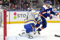 New York Islanders left wing Zach Parise (11) watches as the puck hits the goal post past Buffalo Sabres goaltender Eric Comrie (31) during the second period of an NHL hockey game, Saturday, March 25, 2023, in Elmont, N.Y. (AP Photo/Mary Altaffer)