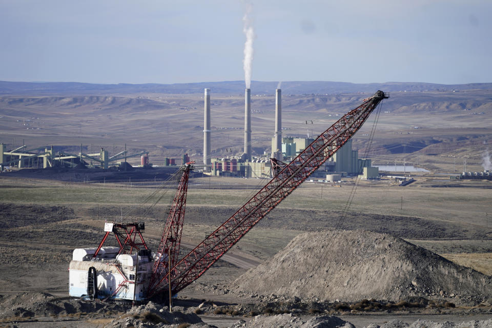 Craig Station, the power plant, in Craig, Colo., sits in the background of the Trapper Mine on Thursday, Nov. 18, 2021, in Craig, Colo. Craig, a small town in northwest Colorado is losing its coal plant, along with the mine that feeds it and residents fear it is the beginning of the end for their community. (AP Photo/Rick Bowmer)