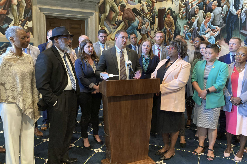 Missouri state Rep. Chris Sander, R-Lone Jack, and House Democrats speak with reporters Wednesday, May 10, 2023, in the state Capitol in Jefferson City, Mo. Sander, who is gay, slammed fellow lawmakers for passing a ban on puberty blockers, hormones and surgeries when used as gender-affirming care for minors. If signed by the Republican governor, Missouri's Medicaid program will no longer cover gender-affirming health care, and transgender and nonbinary prisoners and inmates would no longer be able to get surgeries. (AP Photo/Summer Ballentine)