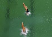 2016 Rio Olympics - Diving - Final - Women's Synchronised 10m Platform - Maria Lenk Aquatics Centre - Rio de Janeiro, Brazil - 09/08/2016. Cheong Jun Hoong (MAS) of Malaysia and Pandelela Rinong (MAS) of Malaysia compete. REUTERS/Michael Dalder FOR EDITORIAL USE ONLY. NOT FOR SALE FOR MARKETING OR ADVERTISING CAMPAIGNS.