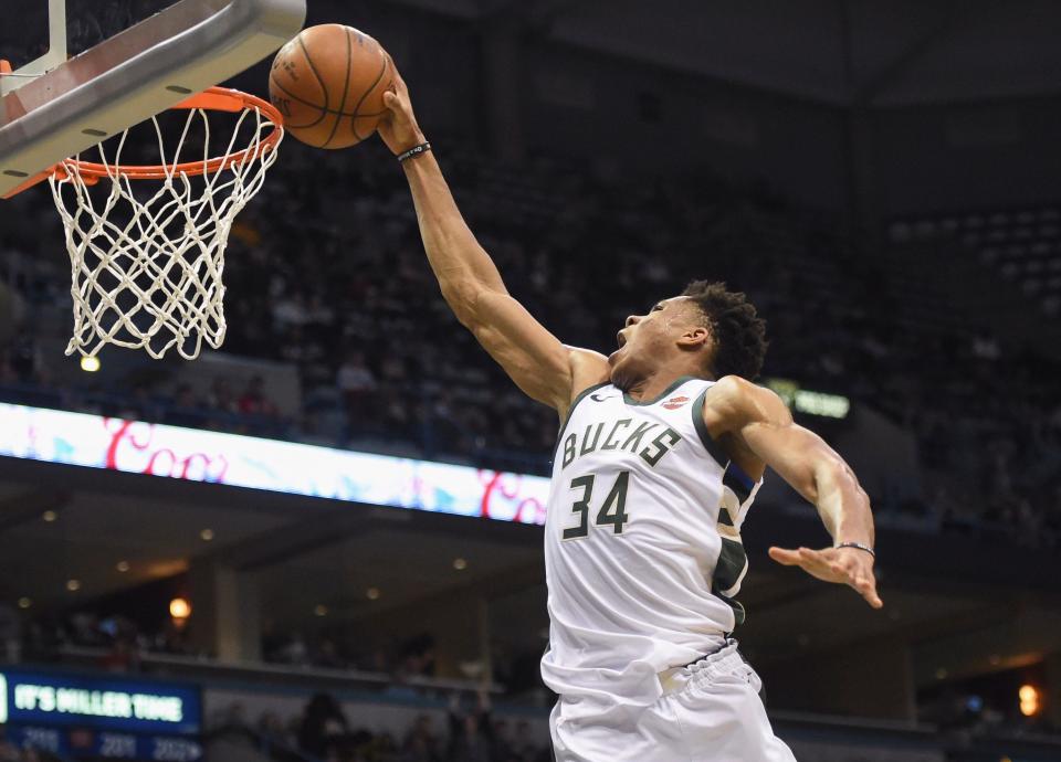 Bucks forward Giannis Antetokounmpo scores a basket in the second quarter against the Atlanta Hawks.