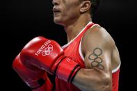 <p>Detail of the tattoo of Morocco's Abdelhaq Nadir depicting Olympic rings as he fights Mauritius' Louis Richarno Colin during their men's light (57-63kg) preliminaries boxing match during the Tokyo 2020 Olympic Games at the Kokugikan Arena in Tokyo on July 25, 2021. (Photo by Luis ROBAYO / POOL / AFP) (Photo by LUIS ROBAYO/POOL/AFP via Getty Images)</p> 