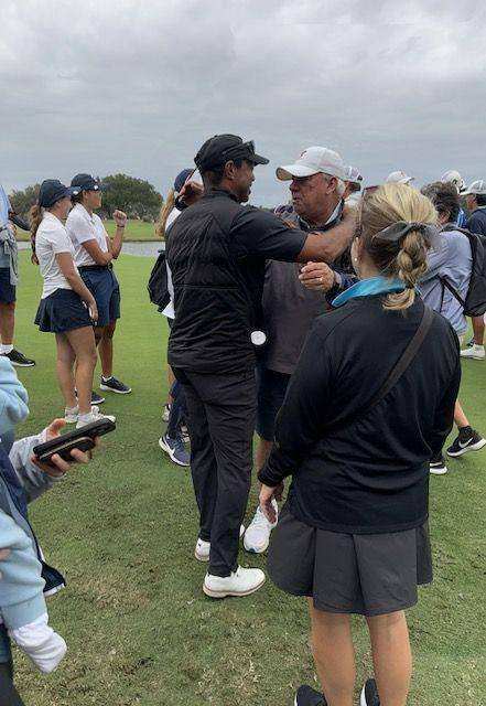 After a historic state championship for his 14 year-old son Charlie, Tiger Woods embraces Benjamin boys golf coach Toby Harbeck at Mission Inn and Resort in Howey-In-The-Hills on November 15, 2023.