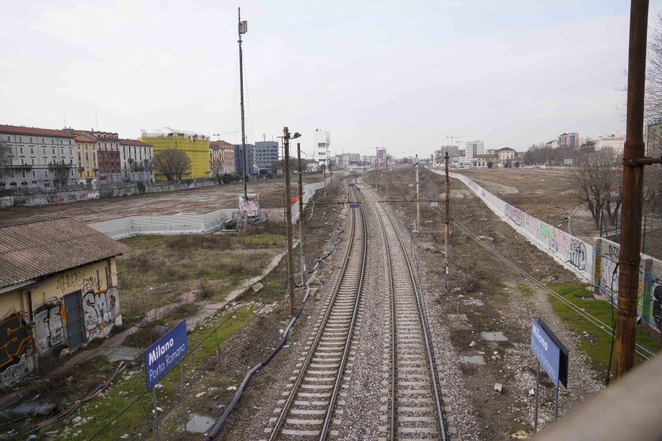 A view of the construction site of the Olympic Village at the Porta Romana former railway yard, in Milan, Italy, Wednesday, March 1, 2023. There is little sign the Winter Olympics are coming to Milan in less than three years. One of the major sites is still an overgrown wasteland and there is minimal construction work at what will be the Olympic Village. The organizing committee for the 2026 Milan-Cortina Olympics says there have been delays and rising costs. (AP Photo/Luca Bruno)