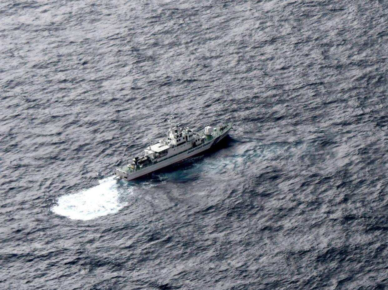 Japan's Coast Guard ship is seen at sea during a search operation for US Marine refueling plane and fighter jet: AP