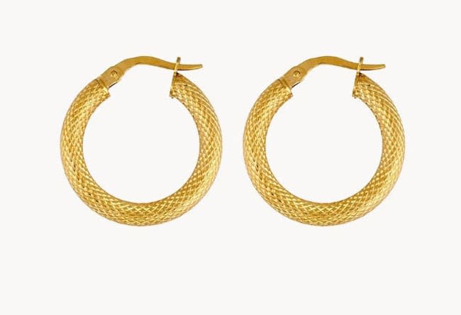 a pair of thick gold hoop earrings