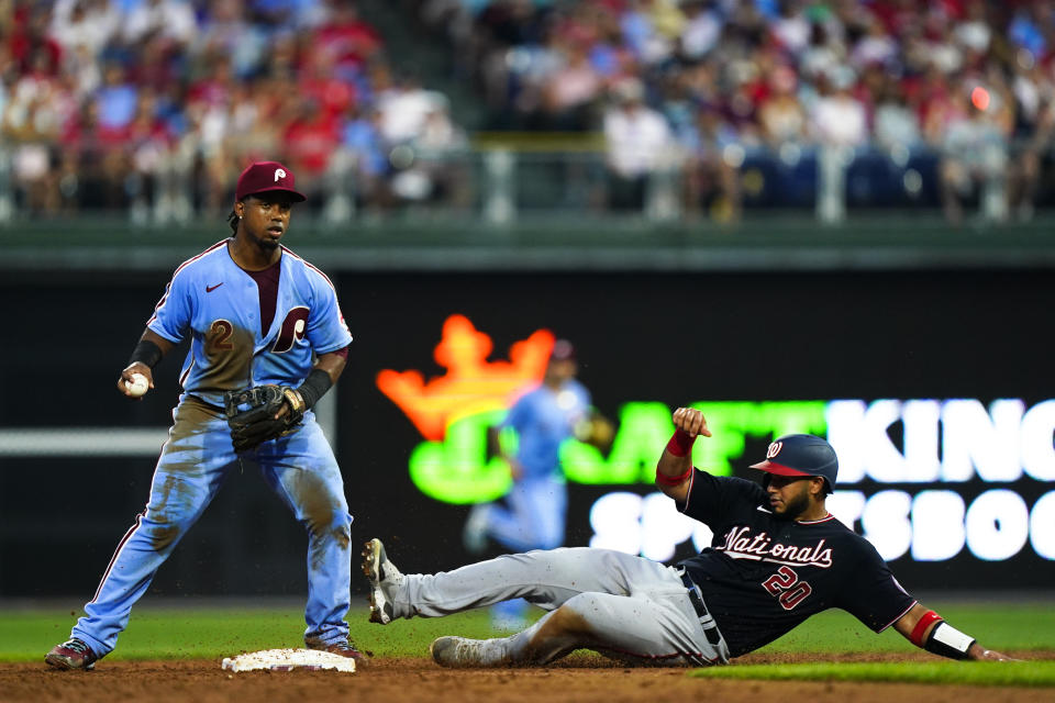 Philadelphia Phillies' Jean Segura forces out Washington Nationals' Keibert Ruiz during the third inning of a baseball game, Thursday, Aug. 4, 2022, in Philadelphia. (AP Photo/Matt Rourke)