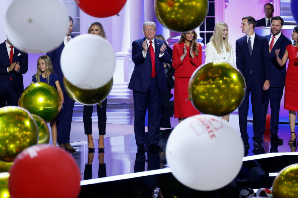 Former President Donald Trump and his family watch from the stage as balloons fall after Trump officially accepted the Republican presidential nomination on the fourth day of the Republican National Convention at the Fiserv Forum in Milwaukee, Wisconsin,  on July 18, 2024. (Photo by Chip Somodevilla/Getty Images)