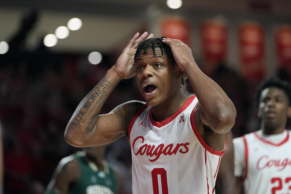 Houston's Marcus Sasser (0) reacts after being called for a foul during the second half of an NCAA college basketball game against the South Florida Wednesday, Jan. 11, 2023, in Houston. Houston won 83-77. (AP Photo/David J. Phillip)