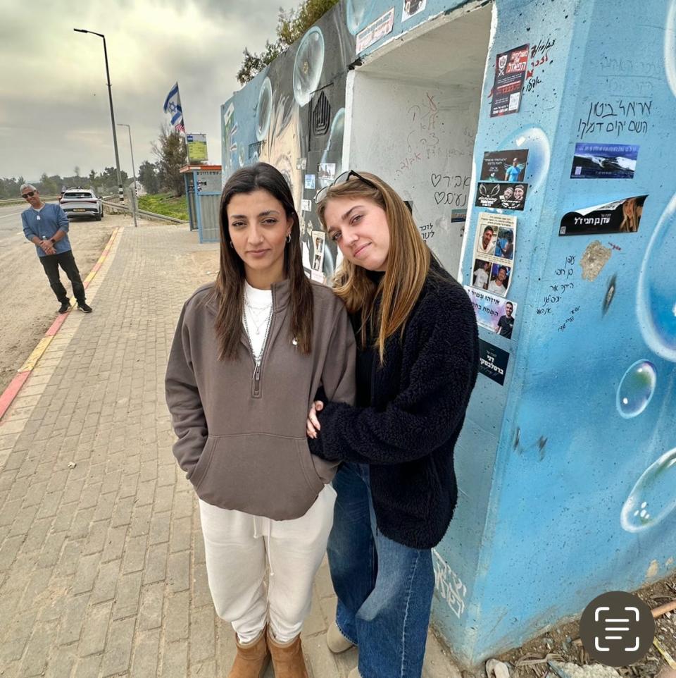 Rotem Yaacovi, 24, and Lina Orlov, 23, survivors of the Nova festival, visiting a nearby bomb shelter where several were killed.
