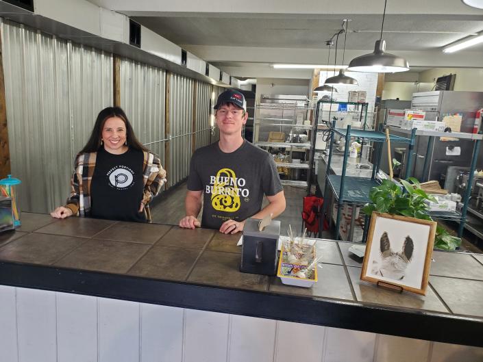 Bueno Burrito owner Nathan Stringer (right) is opening his Thomasville restaurant's kitchen to other food businesses, such as Perfect Portions healthy meal prep owner Bethany Martin (left) and two food trucks.  It allows all involved to pool resources and save money during this time of rising commercial rents and food costs.  Martin will set up her food prep area on the left side of the kitchen, which Stringer has cleared for her.