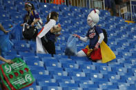 <p>Fans of Japan collect trash after the round of 16 match between Belgium and Japan at the 2018 soccer World Cup in the Rostov Arena, in Rostov-on-Don, Russia, Monday, July 2, 2018. (AP Photo/Pavel Golovkin) </p>