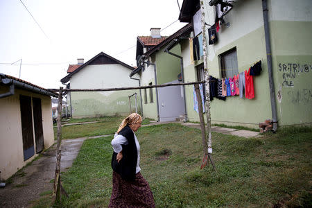 Bosniak Behka Ibisevic, an internally displaced person from Srebrenica, walks through a reception center where IDPs live, in Mihatovici, near Tuzla, Bosnia and Herzegovina, October 2, 2018. REUTERS/Dado Ruvic