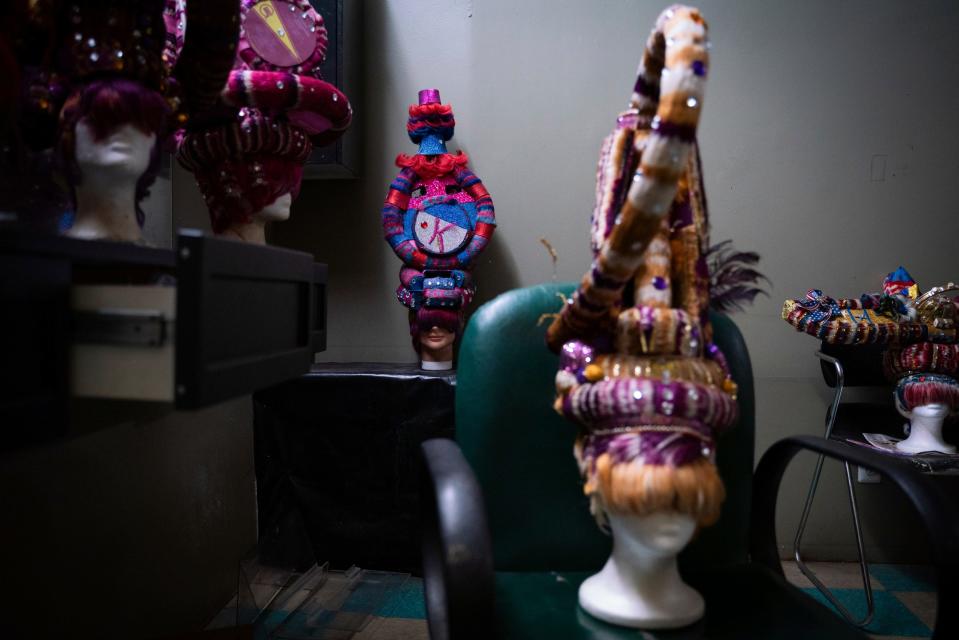 Fantasy wigs from a previous Hair Wars show fill up a room at Keith Matthews' Beauty Village salon in Detroit on Sunday, Sept. 4, 2022.