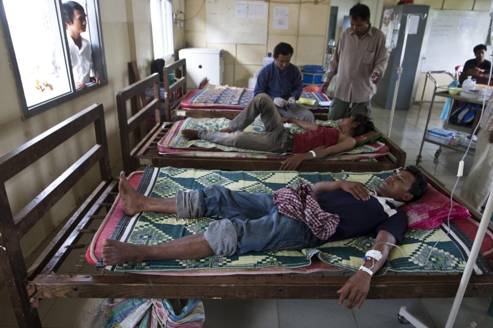 FILE - In this Aug. 26, 2009 photo, patients suffering from malaria lie on the beds as they are treated at a hospital in Pailin, Cambodia. More than a third of the malaria-fighting drugs tested over the past decade in Southeast Asia and sub-Saharan Africa were either fake or bad quality, seriously undermining efforts to combat the disease, a study said Tuesday, May 22, 2012. (AP Photo/David Longstreath, File)