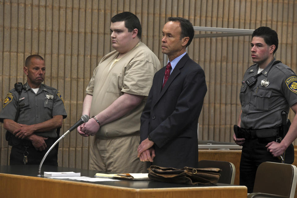 Peter Manfredonia stands during his sentencing hearing in Milford Superior Court, in Milford, Conn. Wednesday, April 19, 2023. Manfredonia was sentenced to 55 years in prison Wednesday for the 2020 murder of his former high school classmate, Nicholas Eisele, in Derby and the kidnapping of Eisele's girlfriend Shannon Spies. Manfredonia is seen here with his defense attorney Michael Dolan. (Ned Gerard/Hearst Connecticut Media via AP, Pool)