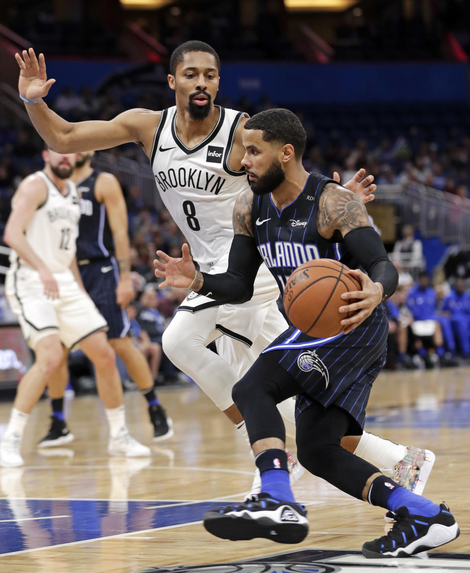 Orlando Magic's D.J. Augustin, right, makes a move to get past Brooklyn Nets' Spencer Dinwiddie (8) during the first half of an NBA basketball game Friday, Jan. 18, 2019, in Orlando, Fla. (AP Photo/John Raoux)