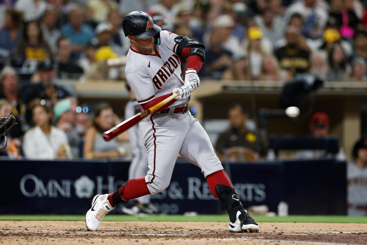 Arizona Diamondbacks' Christian Walker hits a solo home run during the fifth inning of a baseball game against the San Diego Padres Tuesday, Sept. 6, 2022, in San Diego. (AP Photo/Brandon Sloter)