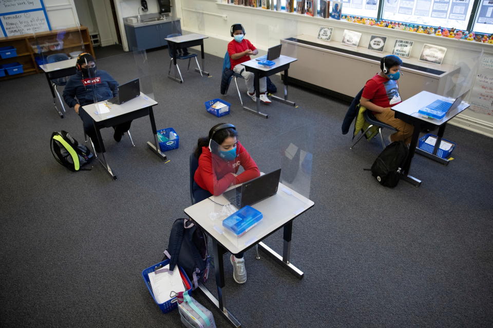 Students attend an in-person learning day at the Mount Vernon Community School in Alexandria, Va., on March 2. (Tom Brenner/Reuters)