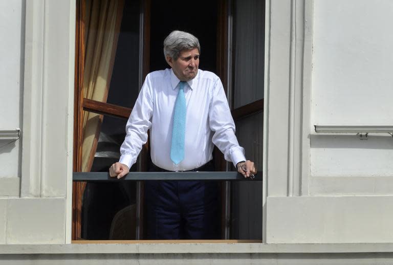 US Secretary of State John Kerry looks out of the window of his room at the Beau-Rivage Palace hotel during a break in the Iran nuclear talks in Lausanne, Switzerland, on April 1, 2015