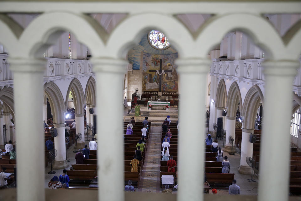 The congregation practises social-distancing to curb the spread of the coronavirus during a Sunday mass at the Holy Cross Cathedral in Lagos, Nigeria Sunday, Aug. 30, 2020. The COVID-19 pandemic is testing the patience of some religious leaders across Africa who worry they will lose followers, and funding, as restrictions on gatherings continue. (AP Photo/Sunday Alamba)