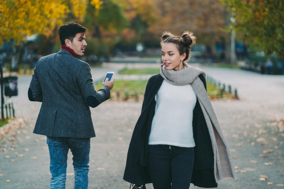 man checking out a woman walking in the park