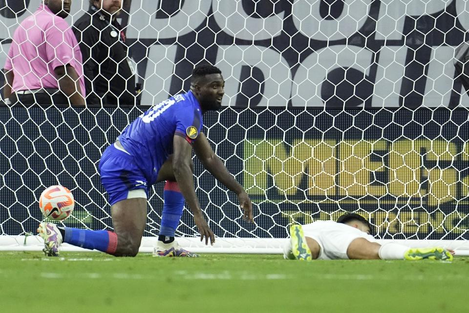 Haiti's Frantzdy Pierrot (20) gets up after scoring the game-winning goal against the Qatar during the second half of a CONCACAF Gold Cup soccer match Sunday, June 25, 2023, in Houston. Haiti won 2-1. (AP Photo/David J. Phillip)