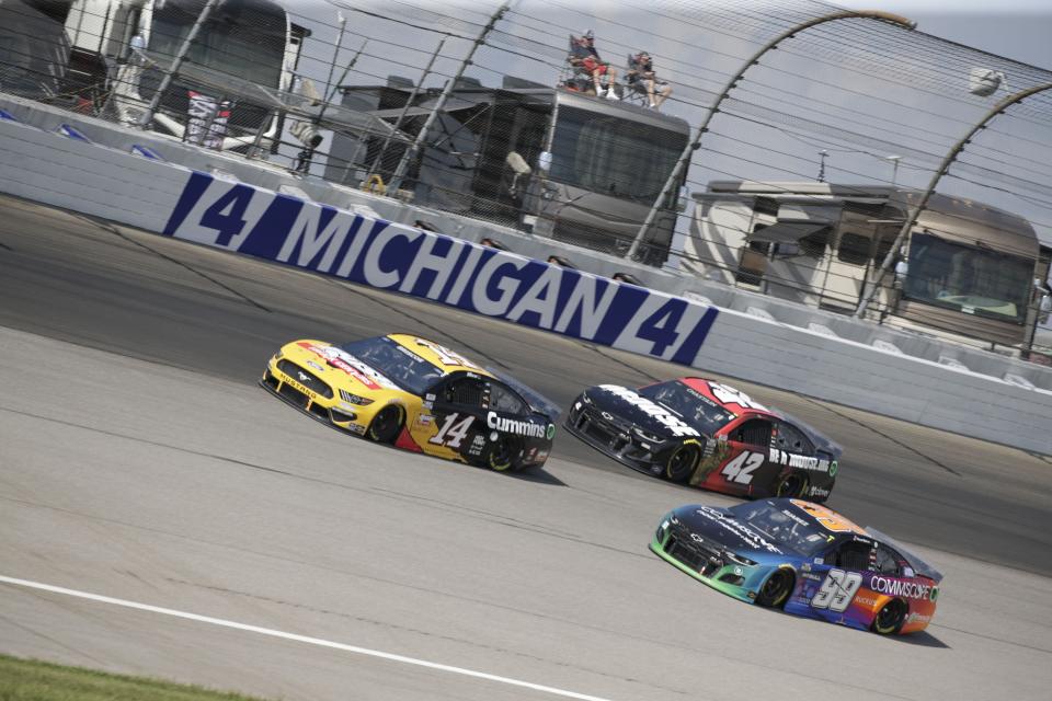 Chase Briscoe (14) leads Ross Chastain (42) and Daniel Suarez (99) through a turn at Michigan International in August. Briscoe will pilot the Cummins car Sunday at Texas Motor Speedway.